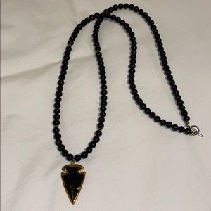 Black beaded necklace with gold & black arrowhead